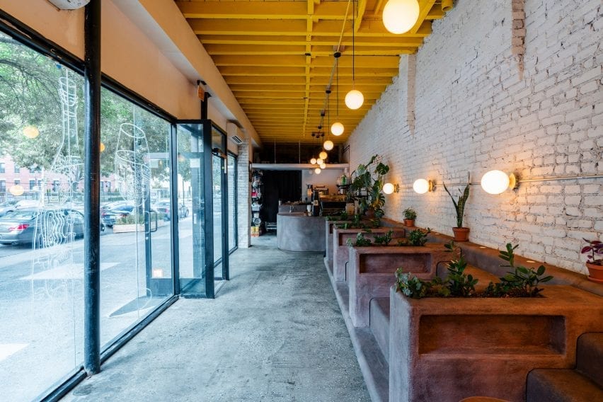 Daughter cafe has stepped seating that mimics brownstone stoops