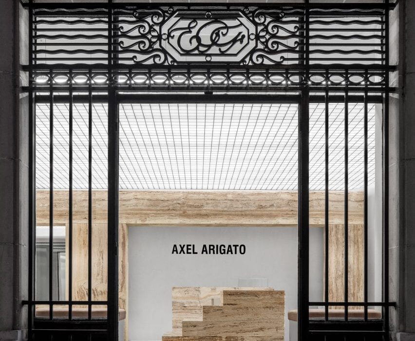 Halleroed inserts sculptural travertine plinths in Axel Arigato s