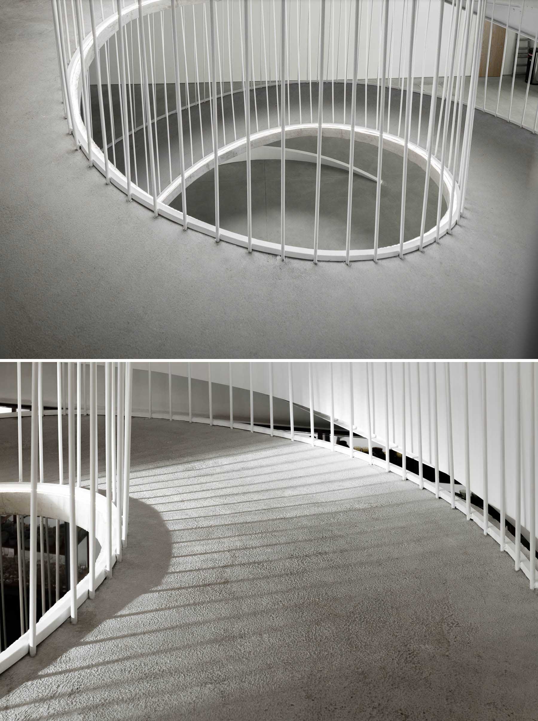 A spiraling ramp replaces the need for stairs in this modern office and adds a sculptural element.