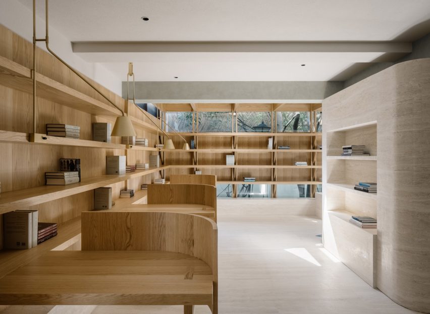 Atelier Tao+C creates serene timber and travertine reading room