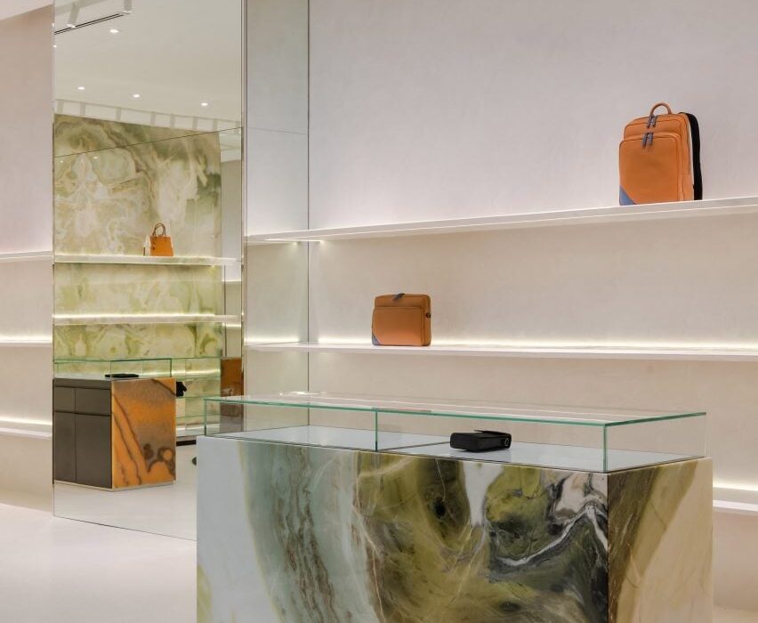 Biophilic design informs moss-covered installation at luxury bag store