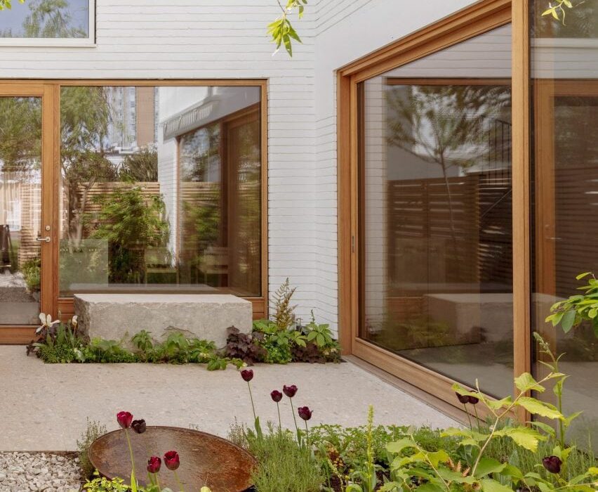 Wood and stone surfaces bring “rich texture” to Primrose Hill House interior