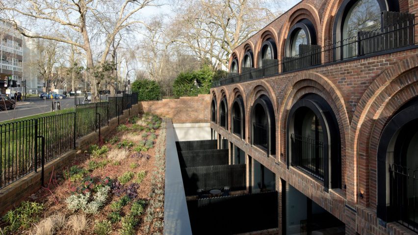 Dezeen Debate features “robust and luxurious” arched townhouses