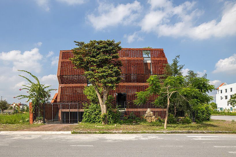 ’tile nest’ unveiled as a nature-infused porous dwelling in vietnam