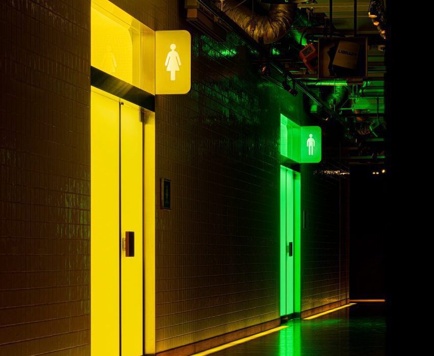 Tile-clad Tokyo toilets are drenched in bright green and yellow light