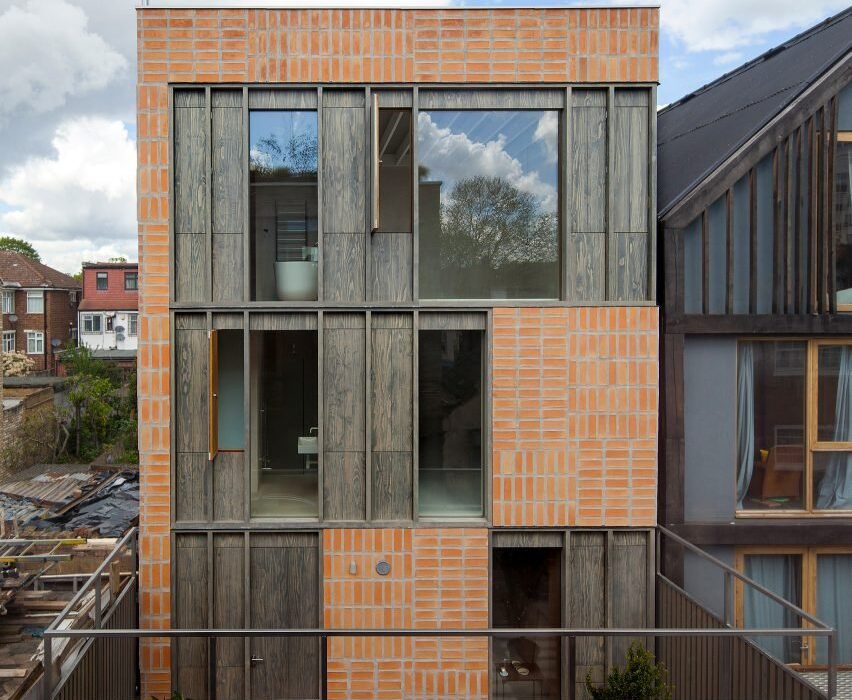 Timber and hempcrete form patchwork facade of London mews house