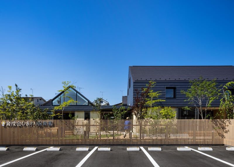 five wooden house-shaped volumes compose nursery school in tokyo