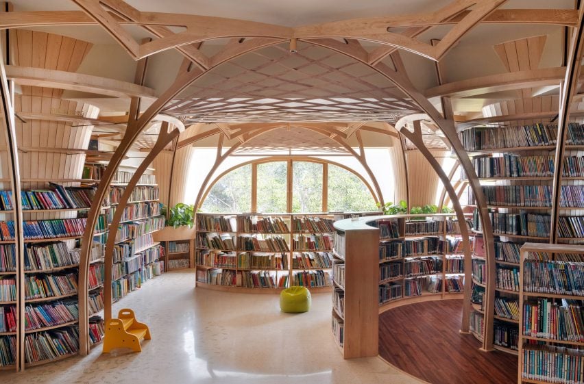 Studio Hinge creates library spaces beneath tree-like wooden columns