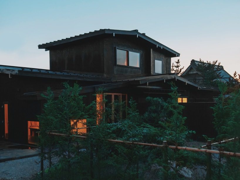 old japanese farmhouse transforms into modest hotel with U-shaped gardens