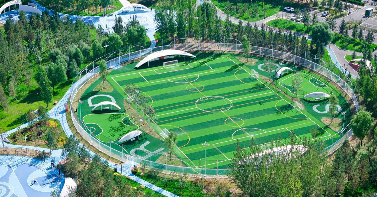 undulating colored pathways run along PLAT ASIA’s sports park in china