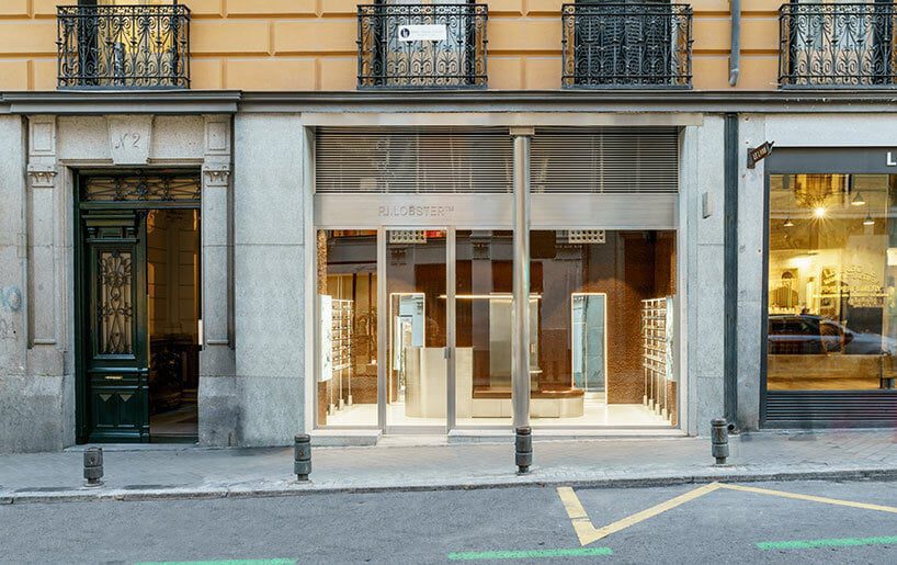 el departamento infuses mountainous hues into texturized optical boutique in madrid