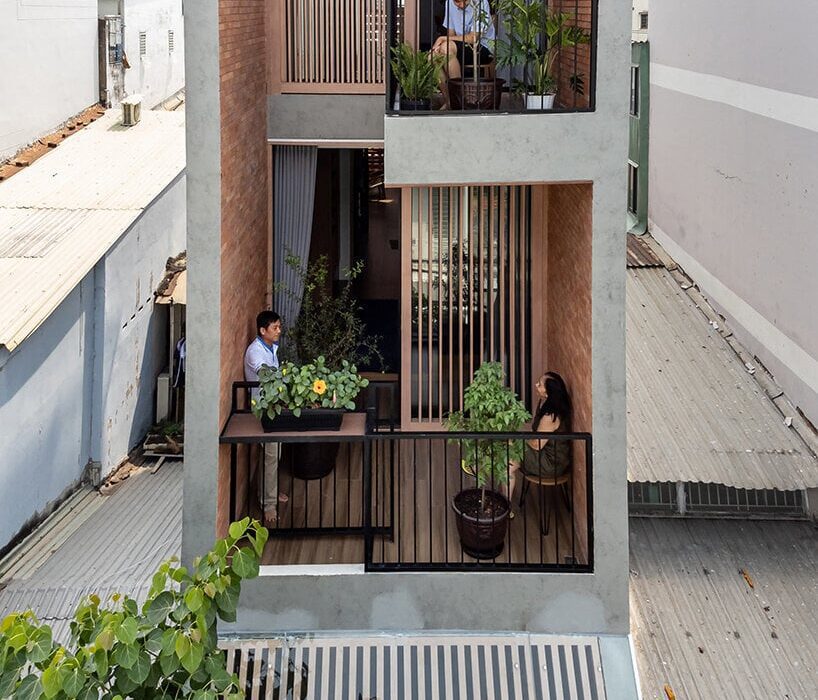 story architecture fronts narrow vietnam house with stacked terraces